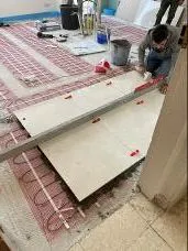 Tiles laid over the underfloor heating