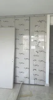 Wardrobe doors still in protective film